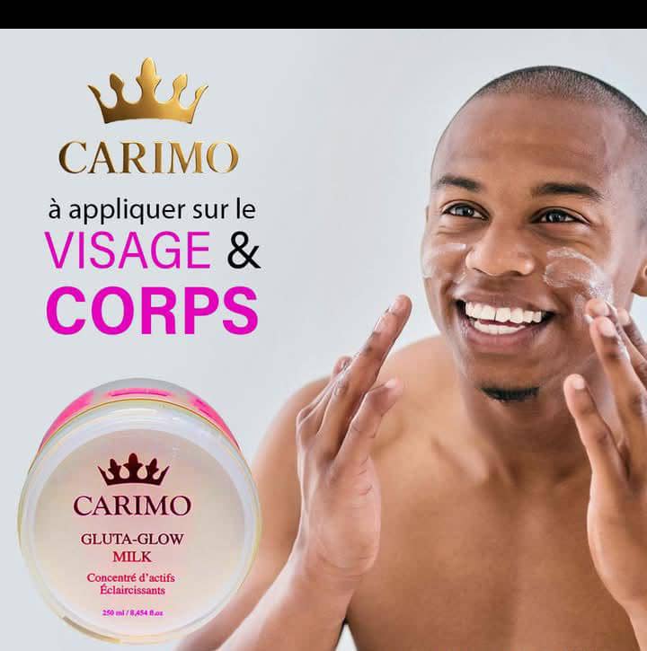 Man applying Carimo gluta Glow cream to his face with Carimo skincare product in the foreground