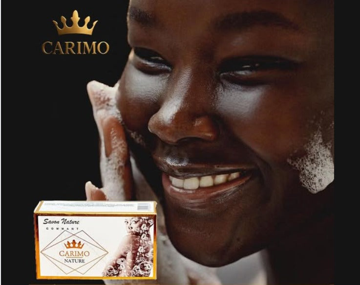 Woman applying soap to her face with a CARIMO soap bar in the foreground.