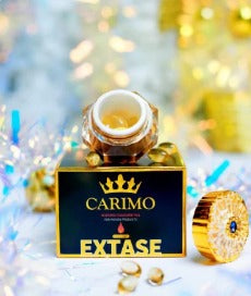 Carimo Passion Capsule bottle and box displayed on a golden background symbolizing energy and vitality.